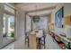 This stylish dining room is bright and airy with waterfront views, designer lighting and outdoor access at 362 41St Ave, St Pete Beach, FL 33706