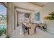 A modern dining room is bright and airy with transom windows overlooking a custom pool at 362 41St Ave, St Pete Beach, FL 33706