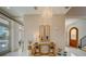 Entryway with tiled floors, console table with decor, and arched doorway; bright and airy atmosphere at 362 41St Ave, St Pete Beach, FL 33706