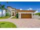 Expansive house view, showing the garage and front entrance with the driveway from the street at 362 41St Ave, St Pete Beach, FL 33706