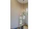 Grand foyer featuring a soaring ceiling, elegant chandelier, and arched windows overlooking the lush landscaping at 362 41St Ave, St Pete Beach, FL 33706