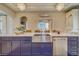 Close up on island featuring quartz counters, stainless steel dishwasher and fixtures at 362 41St Ave, St Pete Beach, FL 33706