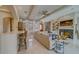 Spacious living room with a marble fireplace, wet bar, and elegant decor in neutral tones at 362 41St Ave, St Pete Beach, FL 33706