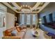 Relax in this living room featuring a tray ceiling, recessed lighting, TV, and comfortable seating at 362 41St Ave, St Pete Beach, FL 33706