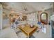 Bright living room with coffered ceiling, large sectional sofa, and archway to kitchen in the background at 362 41St Ave, St Pete Beach, FL 33706