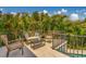 Enjoy this cozy patio with wicker seating surrounded by lush landscaping near the sparkling pool at 362 41St Ave, St Pete Beach, FL 33706