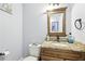 Cozy half bathroom features a granite countertop, wood cabinet, and a toilet at 3802 Cloverhill Ct, Brandon, FL 33511
