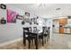 Open dining room with seating for six, seamlessly connected to the kitchen and living area at 3802 Cloverhill Ct, Brandon, FL 33511