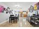 Open dining room with seating for six, seamlessly connected to the kitchen and living area at 3802 Cloverhill Ct, Brandon, FL 33511