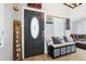 Inviting entryway features a storage bench, decorative welcome sign and access to the living room at 3802 Cloverhill Ct, Brandon, FL 33511