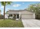 Charming single-Gathering home featuring a two-car garage, manicured lawn, and beautiful landscaping at 3802 Cloverhill Ct, Brandon, FL 33511