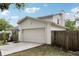 Well-maintained home with a two-car garage, a fenced yard, and mature landscaping at 3802 Cloverhill Ct, Brandon, FL 33511
