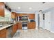 Well-appointed kitchen featuring stainless steel appliances, granite countertops, and ample cabinet space at 3802 Cloverhill Ct, Brandon, FL 33511