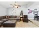 Large living room featuring tile floors, a ceiling fan, and ample seating, with adjacent dining area at 3802 Cloverhill Ct, Brandon, FL 33511