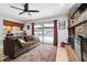 Cozy living room overlooking the pool with a brick fireplace and sliding glass doors at 3802 Cloverhill Ct, Brandon, FL 33511