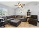 Spacious living room with tile flooring, comfortable seating, and a ceiling fan at 3802 Cloverhill Ct, Brandon, FL 33511