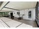 The covered pool patio offers lots of room for workouts and dining at 3802 Cloverhill Ct, Brandon, FL 33511