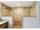 Walk-in shower boasts dual shower heads, granite countertops, and mosaic tile accents at 3802 Cloverhill Ct, Brandon, FL 33511