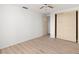 Bedroom featuring a closet and light laminate flooring at 4227 Glissade Dr, New Port Richey, FL 34652