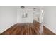 Open living room with hardwood floors, white walls, and recessed lights at 4227 Glissade Dr, New Port Richey, FL 34652