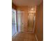 An interior view of a home's bathroom, including a shower and mirrored closet at 4624 W North B St, Tampa, FL 33609