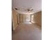 The bedroom has beige walls, carpet, a ceiling fan, a window and three closets at 4624 W North B St, Tampa, FL 33609