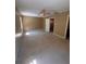 Bedroom with neutral carpet, tan walls, ceiling fan, and a view to the stairway at 4624 W North B St, Tampa, FL 33609