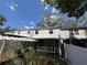 Low angle exterior shot with a partial view of the fenced in backyard at 4624 W North B St, Tampa, FL 33609