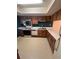 Kitchen with wood cabinets, white countertops, and a range of appliances at 4624 W North B St, Tampa, FL 33609