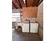 Interior laundry area with a sink, cabinet, and exposed beams on the ceiling at 4624 W North B St, Tampa, FL 33609