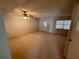 Spacious living room with carpet, ceiling fan, and natural light at 4624 W North B St, Tampa, FL 33609