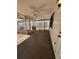 A screened porch with a ceiling fan at 4624 W North B St, Tampa, FL 33609