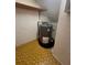 A close interior view of the home's hot water heater with room for storage at 4624 W North B St, Tampa, FL 33609