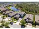 Aerial view of community with well-maintained lawns, and lake views at 4777 Ballantrae Blvd, Land O Lakes, FL 34638