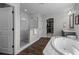 Bright bathroom featuring a soaking tub, shower, and walk-in closet at 4777 Ballantrae Blvd, Land O Lakes, FL 34638