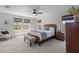 Bright bedroom featuring hardwood furniture, carpet, and ample sunlight at 4777 Ballantrae Blvd, Land O Lakes, FL 34638
