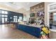 Bright cafe area featuring ample seating, granite countertops, televisions, and snack options for residents to enjoy at 4777 Ballantrae Blvd, Land O Lakes, FL 34638