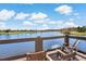 Relaxing waterside patio views and chairs at the community clubhouse at 4777 Ballantrae Blvd, Land O Lakes, FL 34638