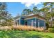 Exterior view of the community fitness center with attractive landscaping and inviting entryway at 4777 Ballantrae Blvd, Land O Lakes, FL 34638