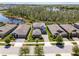 Beautiful home featuring a large driveway and a well-manicured front yard with lake views at 4777 Ballantrae Blvd, Land O Lakes, FL 34638