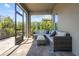 Relaxing screened patio with comfortable wicker seating, perfect for enjoying the outdoors at 4777 Ballantrae Blvd, Land O Lakes, FL 34638