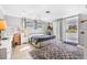Bright bedroom features a ceiling fan, tiled floors, a rug, and sliding glass doors to the outside at 615 10Th Ne Ave # 1, St Petersburg, FL 33701