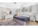 Spacious bedroom with a large rug, white dresser, and bright natural light at 615 10Th Ne Ave # 1, St Petersburg, FL 33701