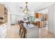Bright dining area with modern lighting and easy access to the kitchen and living areas at 615 10Th Ne Ave # 1, St Petersburg, FL 33701