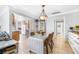 Bright dining area with modern lighting and easy access to the kitchen and hallway at 615 10Th Ne Ave # 1, St Petersburg, FL 33701