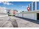 Condominium garages with locator pings, surrounded by lush landscaping and blue skies at 615 10Th Ne Ave # 1, St Petersburg, FL 33701