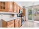 Bright kitchen with wood cabinets, white counters, and a stainless steel oven at 615 10Th Ne Ave # 1, St Petersburg, FL 33701