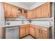 An expansive kitchen with wood cabinets, white counter tops, and stainless appliances at 615 10Th Ne Ave # 1, St Petersburg, FL 33701