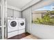 Laundry area features a washer and dryer, with a view of the outdoors at 615 10Th Ne Ave # 1, St Petersburg, FL 33701