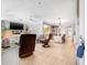 Open-concept living room with tile flooring, and a view into the dining and kitchen areas at 615 10Th Ne Ave # 1, St Petersburg, FL 33701